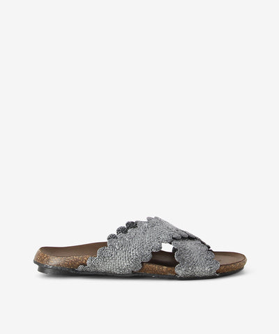 Grey crossed sandals by Sempre Di. It is a slip-on style with woven raffia upper, a cork finish footbed and a round toe.
