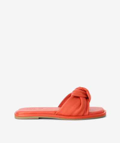 Cardinal leather slides by Inuovo. Is a slip-on style and features twisted leather straps, a low heel and a soft square toe. 