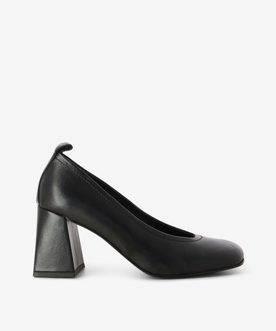 Black leather court shoes by Sempre Di. It is a slip on style and features a rear pull tab, block heel, and a soft square toe.