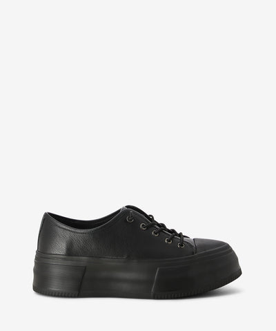 Black leather sneakers by 'Django & Juliette'. It has a lace-up fastening and features a platform sole and a round toe.