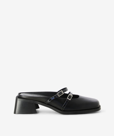 Black leather mule by Justine Clenquet. Is a slip-on style features two adjusted pin-buckle thin straps with a medium heel and a round toe.