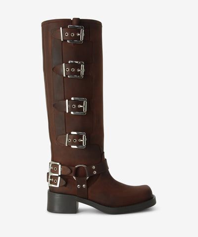 Dark brown leather knee high boots with a multiple buckle fastening and features a layered heel and a soft square toe.