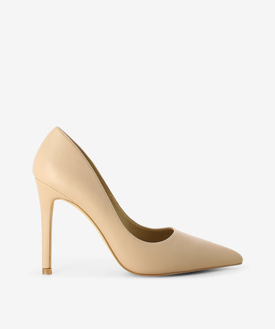 Nude leather pumps by Siren. It is a slip on style and features a stiletto heel, and a pointed toe.