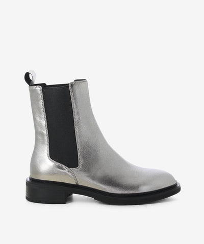 Pewter metallic leather chelsea boots by EOS. It features elasticated side gussets, rear pull tab, and a round toe.