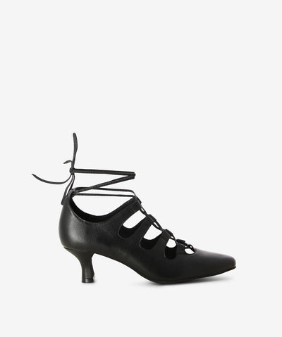 Black leather heels by Django & Juliette. It has an ankle tie fastening and features lace up strappy and a pointed toe.