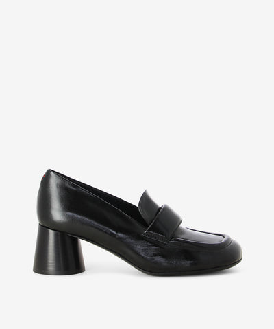 Black leather loafers by Halmanera. Is a slip-on style and features a mid a cylindrical heel and a soft square toe.