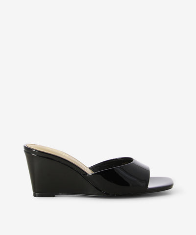 Black patent leather heel by 'Siren'. It has a flattering upper and features a wedge heel and a square toe.