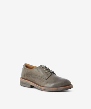 Grey vintage-look leather derby shoes by Rollie. It has a lace-up fastening and features a mid-height cushioned sole, and a round toe. Each pair in this colour varies slightly due to the vintage look leather.