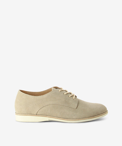 Light stone suede derby shoes by Rollie. It has a lace-up fastening and features a suede upper, low contrast sole and an almond toe.