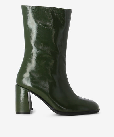 Green patent leather boots by S Sempre Di. It features a side zip closure, block heel, and a round toe.