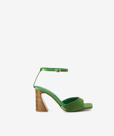 Green satin heels by Caverley. It has an ankle buckle fastening and features a strappy upper, angled heel and an open square toe.