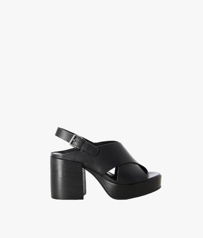 Black leather platform sandals by Elvio Zanon. It has a slingback buckle fastening and features a crossover upper, chunky heel and an open round toe.