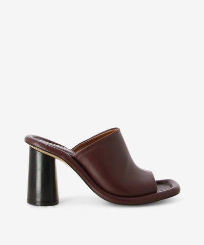 Dark brown leather heels with a slip-on style and features an outer cushioned insole, block heel and a soft square toe. 