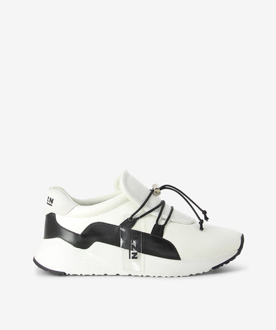 White leather sneakers by Elvio Zanon. It has a lace-up fastening with toggle fixture, chunky platform and an almond toe.