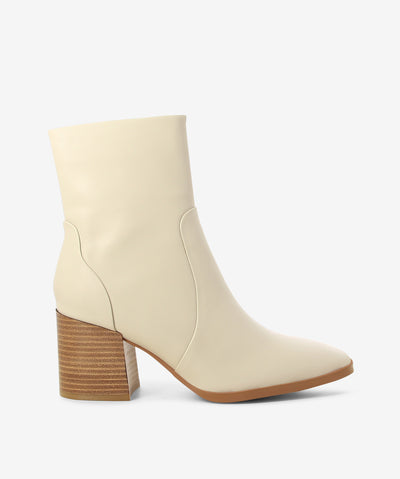 Ivory leather boots by EOS. It features a side zipper closure, block heel, and a soft pointed toe.