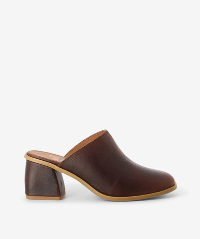 Brown leather mules by Nu by Neo. It is a slip on style and features a leather wrapped block heel, and a round toe.