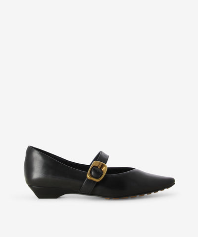 Black leather Mary-Janes by 2 Baia Vista. It features a cross-foot strap with a organically shaped hardware and pin-buckle closure, a low tapered block heel, and a pointed toe.