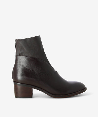 Chocolate brown leather ankle boots by Django & Juliette. It features a combination stretch leather upper, rear zip closure, and a round toe.