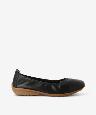 Black leather ballet flats by Martini Marco. It features an elasticated upper, rear pull tab, and a round toe.