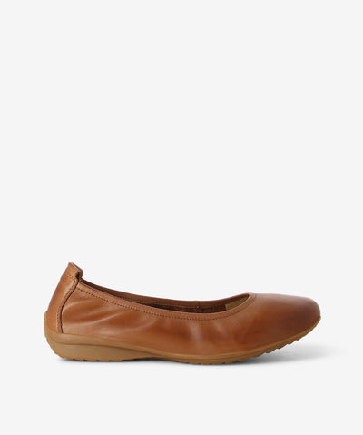 Cognac leather ballet flats by Martini Marco. It features an elasticated upper, rear pull tab, and a round toe.