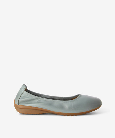 Light blue leather ballet flats by Martini Marco. It features an elasticated upper, rear pull tab, and a round toe.