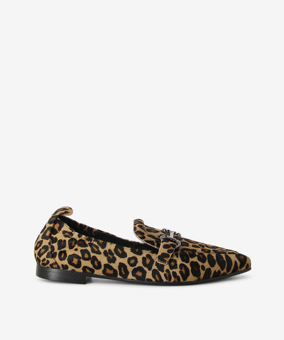 Leopard print pony hair loafers by Martini Marco. It is a slip on style and features an all over leopard print, low block heel, and a pointed toe.