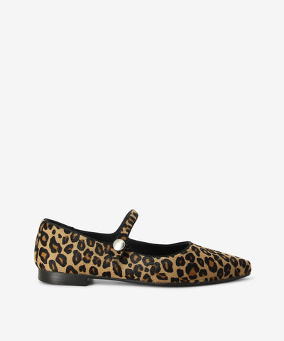 Leopard print pony hair flats by Martini Marco. It has an elasticated cross foot strap with an all over leopard print, low block heel, and a pointed toe.
