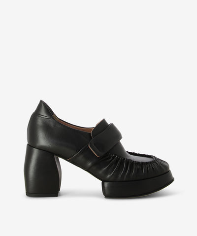 Black leather heeled loafers with a slip-on style and features ruched leather detailing, a block heel, platform sole and a round toe.