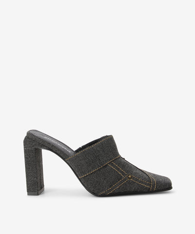 Black denim closed mules with trompe-l'œil denim detailing, a slender heel and a square toe by Jeffrey Campbell.