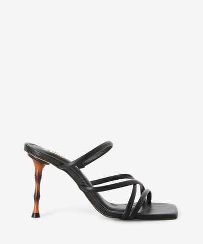 Black leather heels featuring a strappy upper, bamboo stiletto heel and a square toe.
