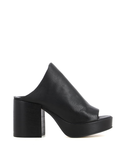 A black leather platform mule by Elvio Zanon. The 'KAZ1601X' features a curved upper, a block heel and a round toe.