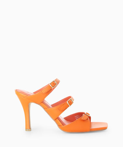 Orange leather heels with three buckled straps, a high heel and a soft square toe.