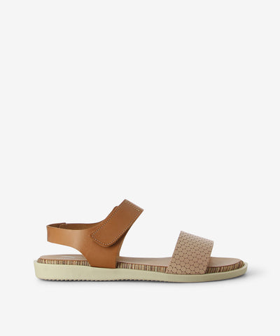 The 1242 Marila Sandal — a playful blend of colour, texture, and Spanish craftsmanship. Featuring a soft skin sand front strap with a unique hex pattern, a rounded toe for added comfort, and a smooth brown leather ankle strap, this cheerful style sits on a multi-coloured striped sole that brings joy to every step. Crafted from premium leather for lasting comfort and quality, it features an adjustable velcro ankle strap, a lightweight sole with striped detailing, and a low heel for easy, all-day wear.