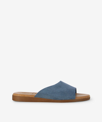 Step into effortless style with the Marilla 1423 slide — a simple yet striking design made in Spain with care. This easy slide features a wide textured blue strap that adds a cool, modern touch to any outfit. Designed with a soft blue front strap with subtle texture, a smooth brown sole for everyday comfort, a round toe for a relaxed fit, and a flat profile for easy wear all day long.