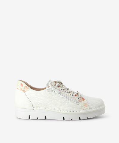 White leather sneakers by 'Josè Saenz'. It has a lace-up fastening and features floral print leather paneling on its upper and an almond toe.