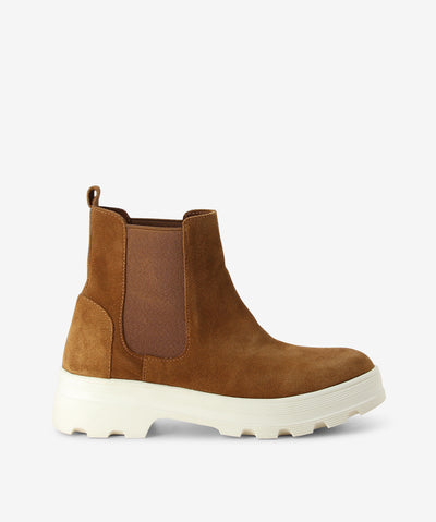 Tan suede Chelsea boots by Martini Marco. It has an elastic gusset, rear pull tab, and chunky tread sole.