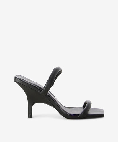 Black leather heels by Sempre Di. It is a slip-on style and features dual padded straps, stiletto heel and a square toe.