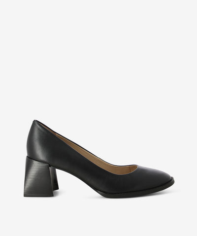 Black leather court shoes by Brazilio. It is a slip on style and features a contoured block heel and a round toe.