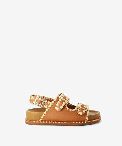 Tan sandals with contrast threaded weave trim by Inuovo. Features a slingback strap and an upper pin buckle straps fastening with a moulded footbed and a round toe.
