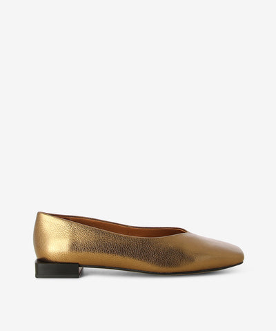 Bronze metallic flats by Neo. It is a slip on style and features a low square heel, textured metallic upper, and a chisel toe.