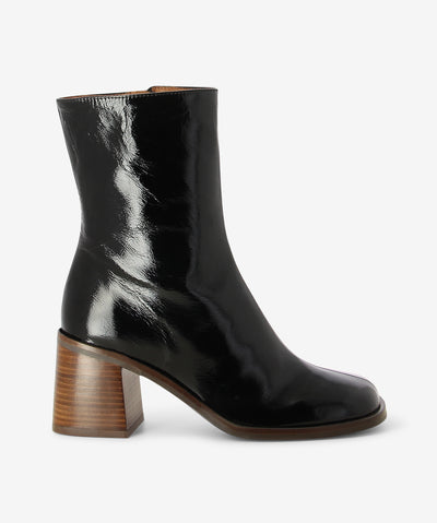 Black leather ankle boots by Neo. It features a block heel, side zip closure, and a soft square toe.