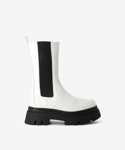 White leather Chelsea boots by Alohas. A pull-on style with elastic gussets and features a rear pull tab, a chunky track sole and a round toe.