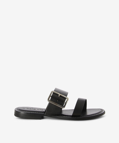 Black leather slides with a slip-on style and features two straps with a chunky buckle, a low stacked heel and a round toe.