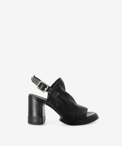 Black leather heeled sandals by Sempre Di by A.S.9.8. It has a slingback strap with a high coverage upper and features a platform midsole, partially stacked wooden heel, and a round toe.