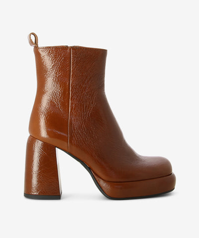 Brown crinkled leather ankle boots with an inner zip fastening and features a pull tab, platform sole, chunky block high heel and a square toe.