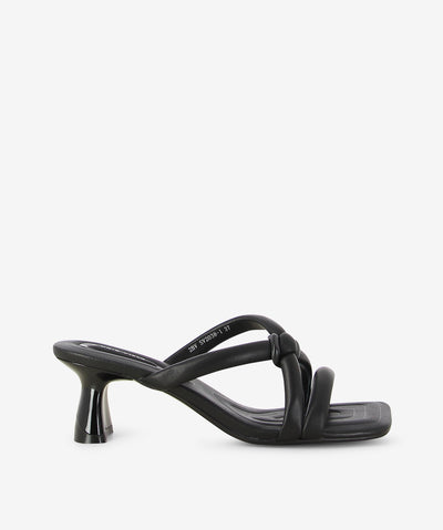 Black leather heels by 2 Baia Vista. It is a slip on style and features padded cross straps with an interlocking plastic fixture, contoured component block heel, and a square toe.