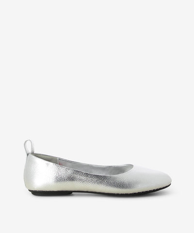 Silver leather ballet flats by Rollie. It is a slip-on style and features a grained leather upper, comfortably flexible rubber outsole and a round toe.