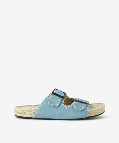 Denim blue suede espadrille sandals by 2 Baia Vista. It is a slip-on style and features a blanket stitched edge upper, espadrille sole, and a round toe.