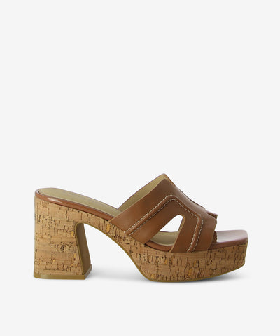 Tan leather and cork heels by 2 Baia Vista. It features a cork heel and platform, contrast stitched upper, and a square toe.