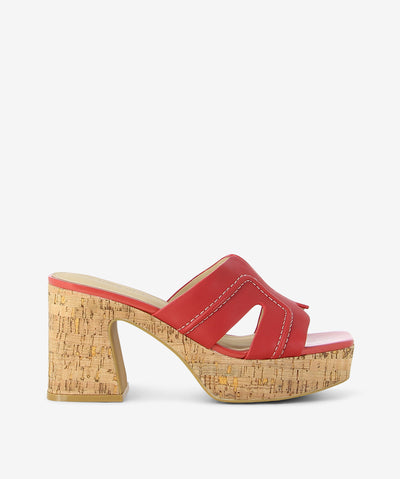 Red leather and cork heels by 2 Baia Vista. It features a cork heel and platform, contrast stitched upper, and a square toe.